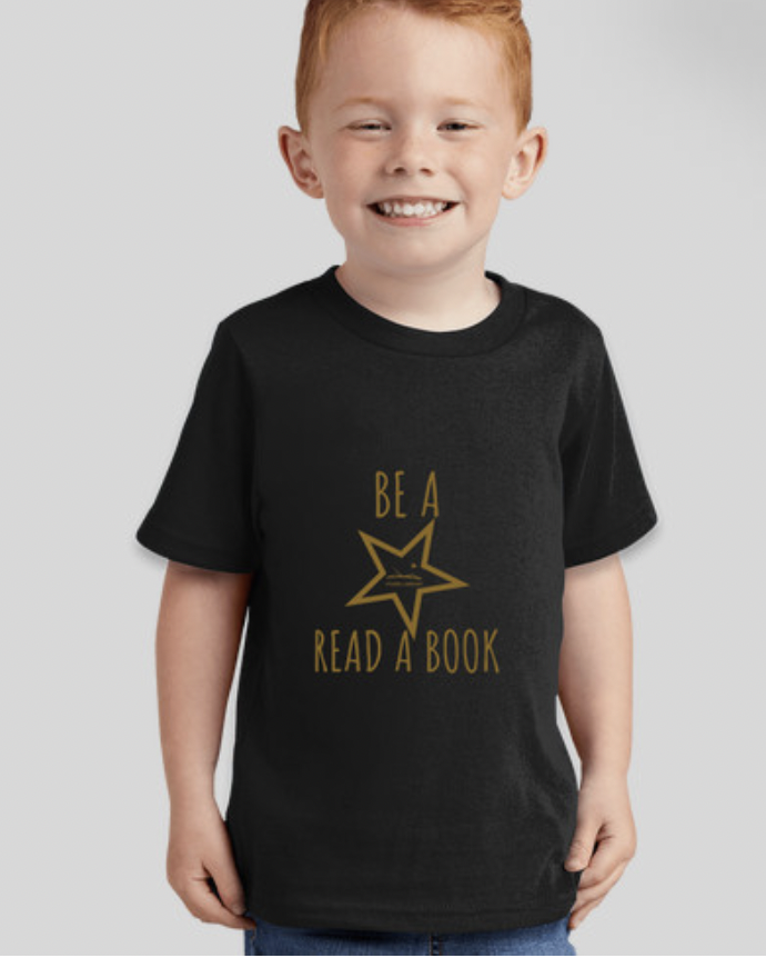 Young child in t-shirt that reads "Be a Star, Read a Book"